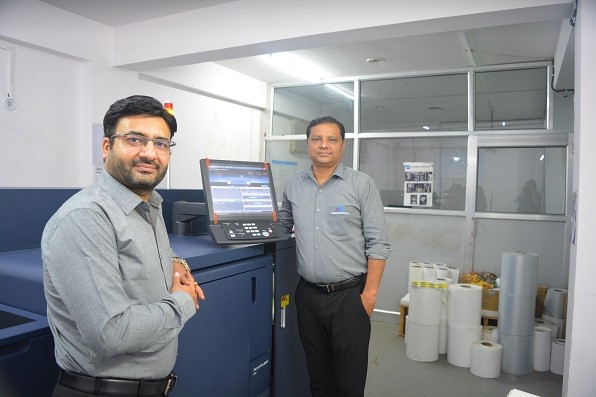 Dheeraj Sharma, managing director of M.D Graphics (on the left) with the AccurioLabel 230