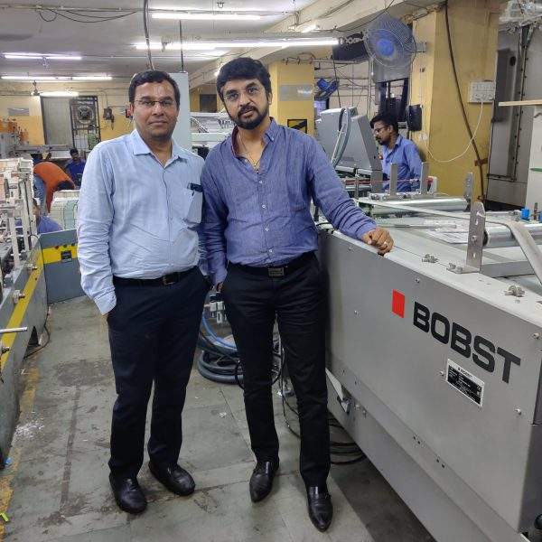 L to R: Chirag Bhalavat and Parag Ghelani with the Bobst 76 A1 folder gluer Photo by PSA
